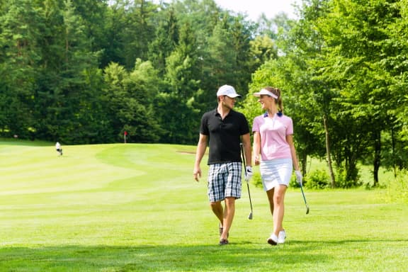 Couple golfing together