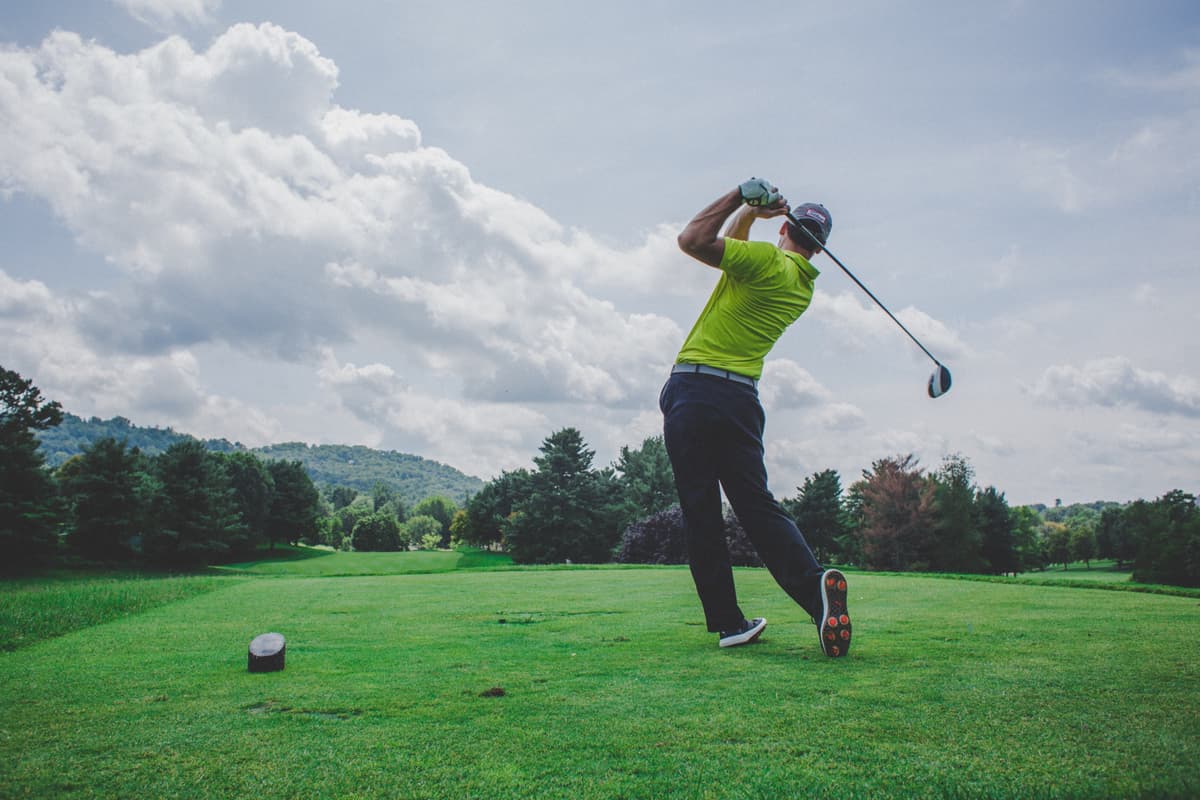 Golfer teeing off